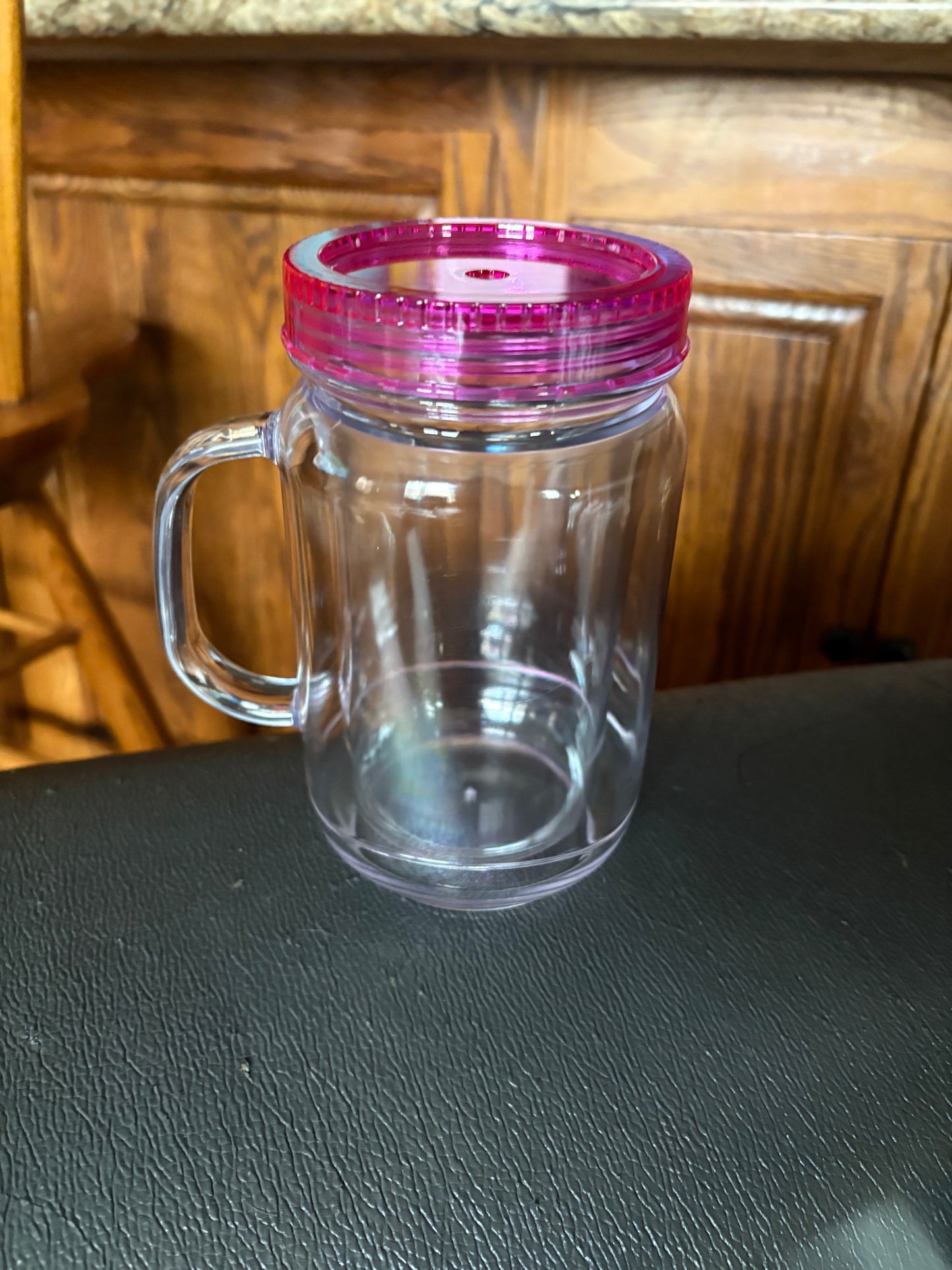 A 20 oz mason jar snow globe cup