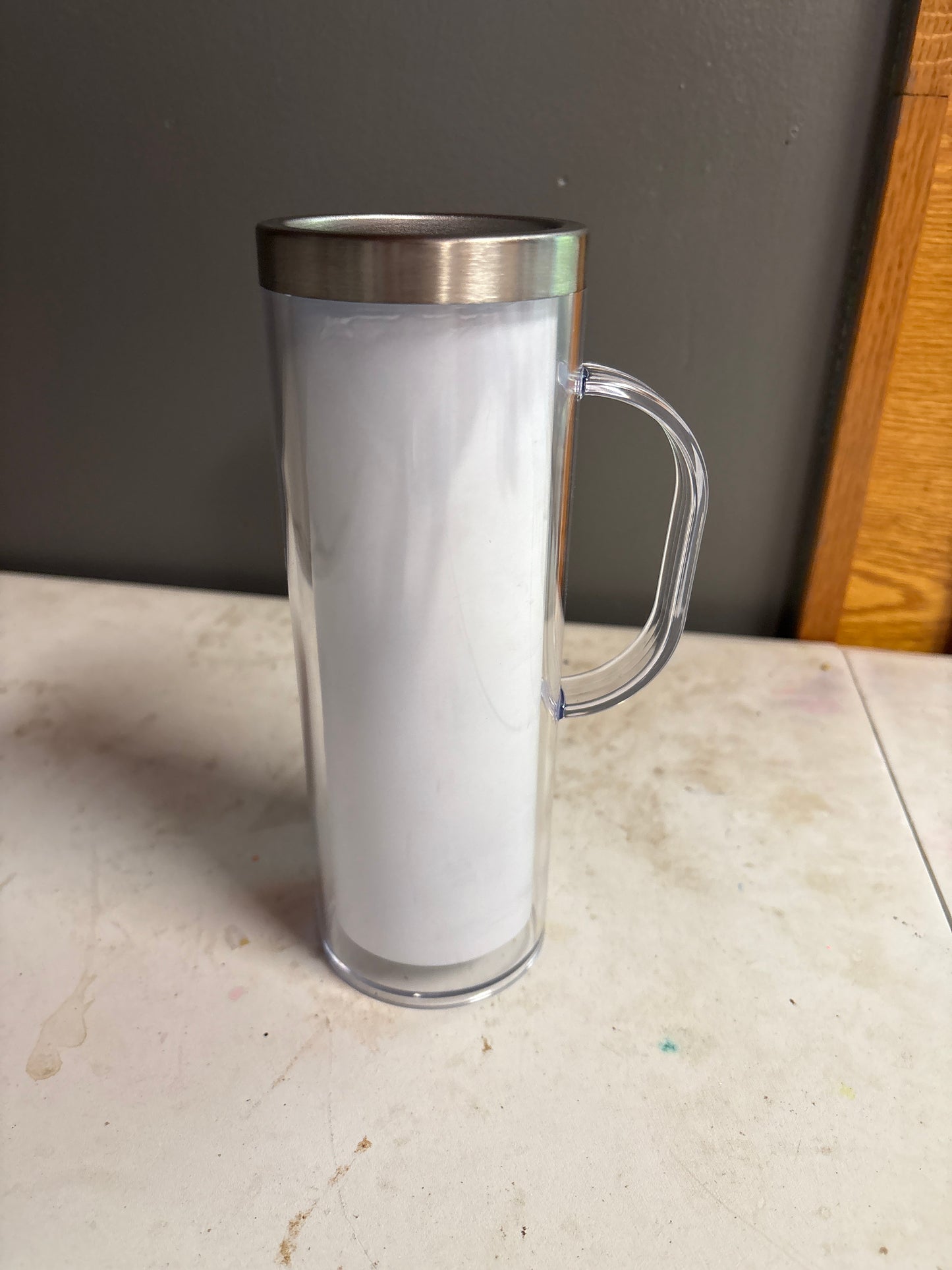 A 20 oz stainless steel handled snow globe