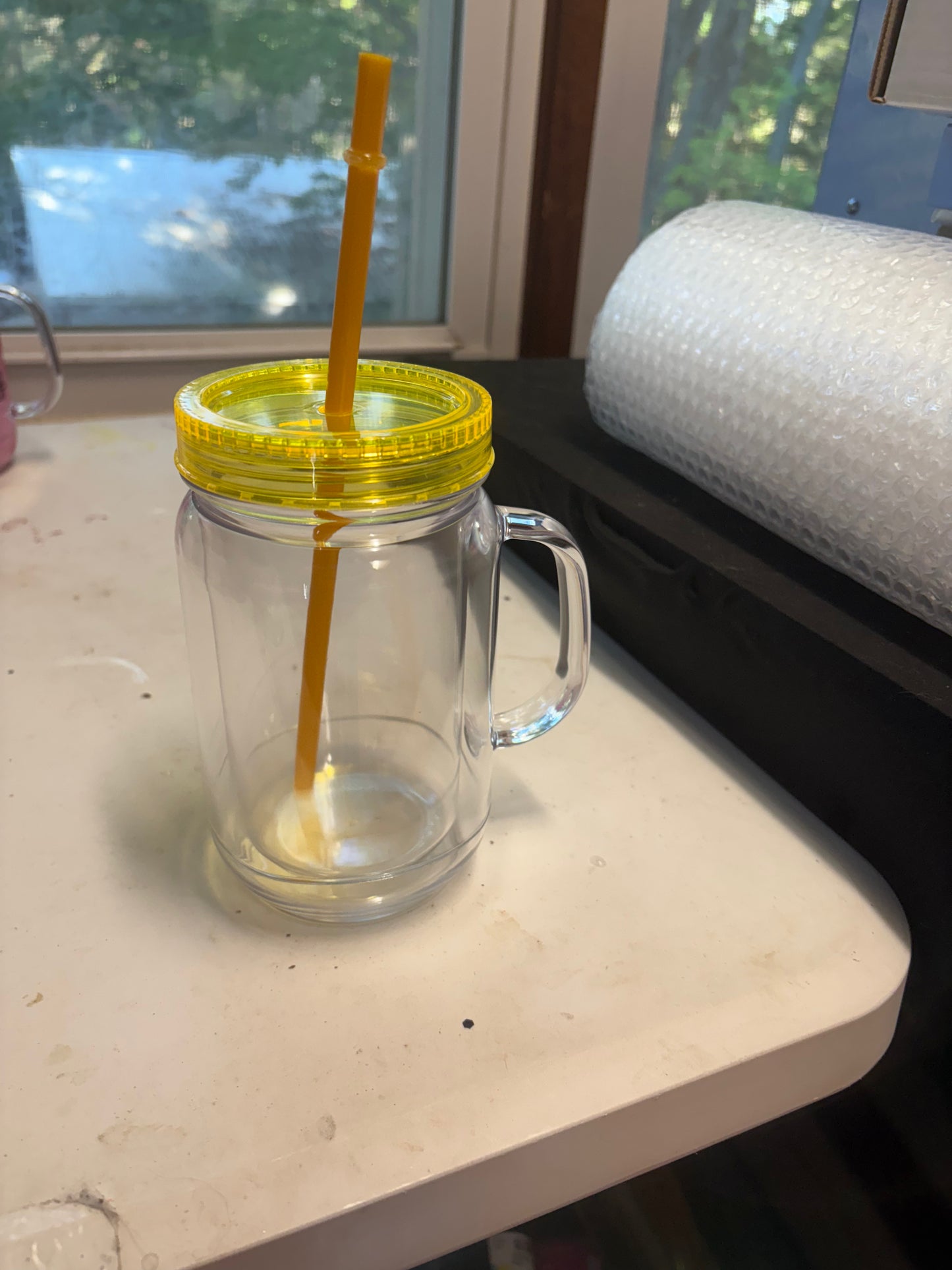 A 20 oz mason jar snow globe cup
