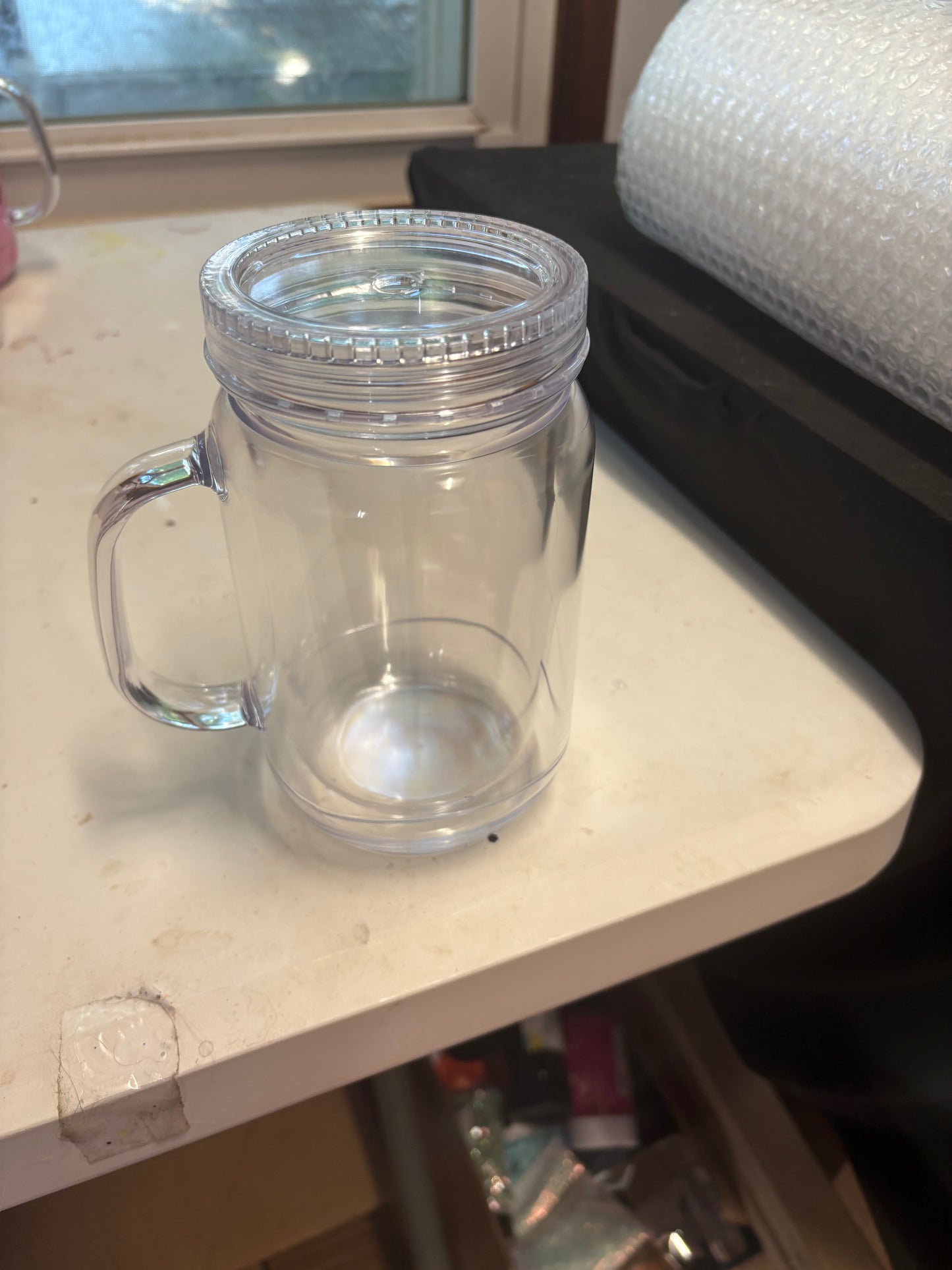A 20 oz mason jar snow globe cup