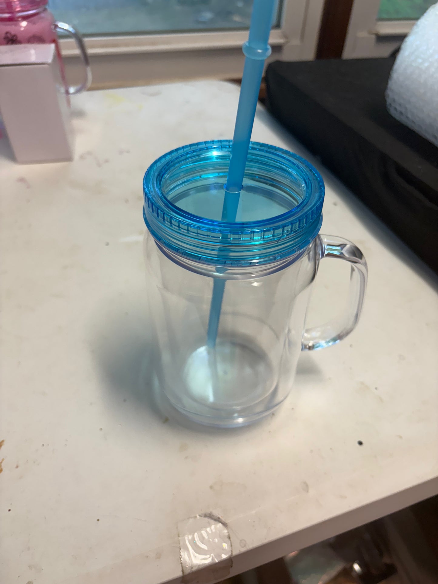 A 20 oz mason jar snow globe cup