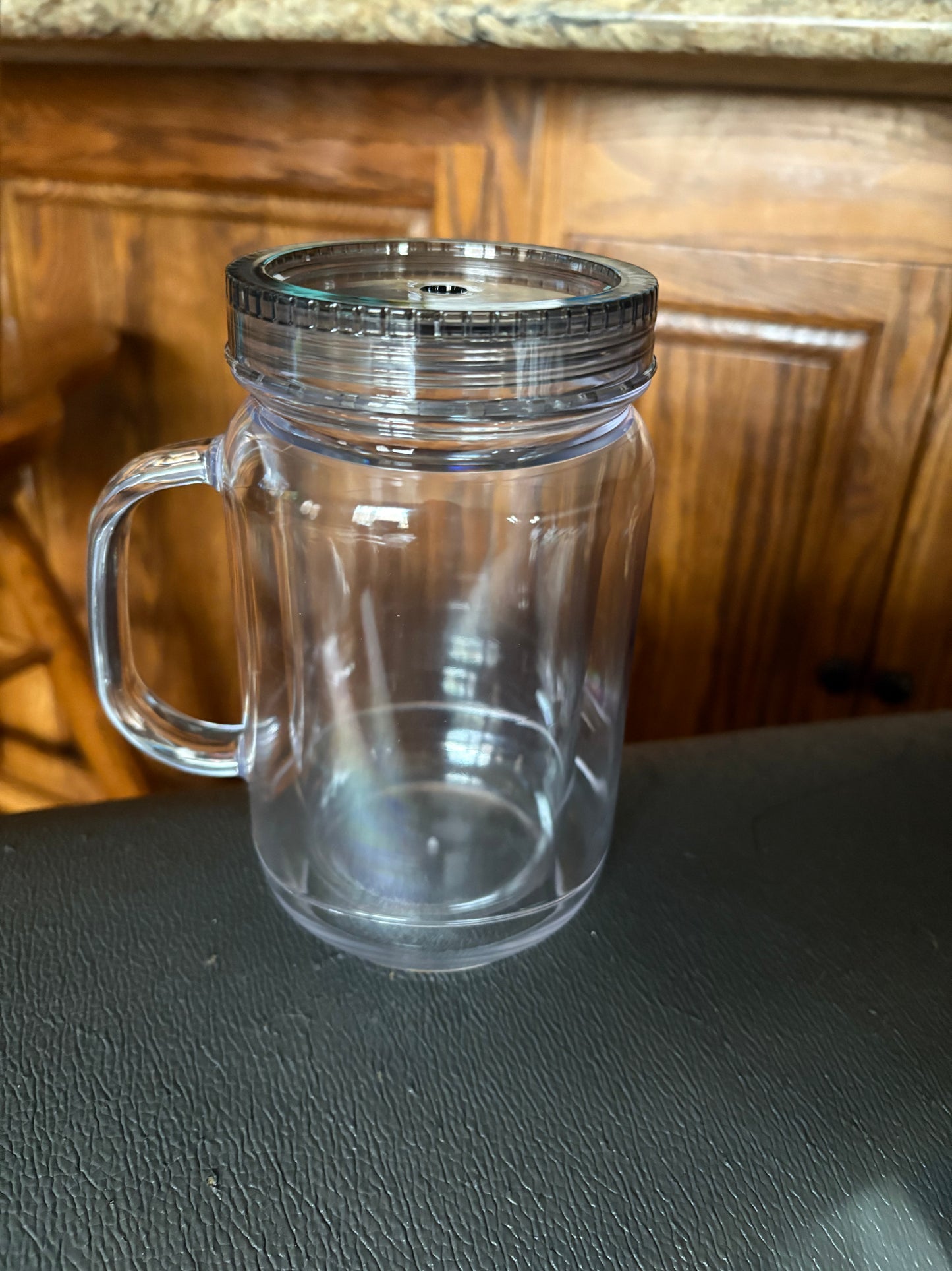 A 20 oz mason jar snow globe cup