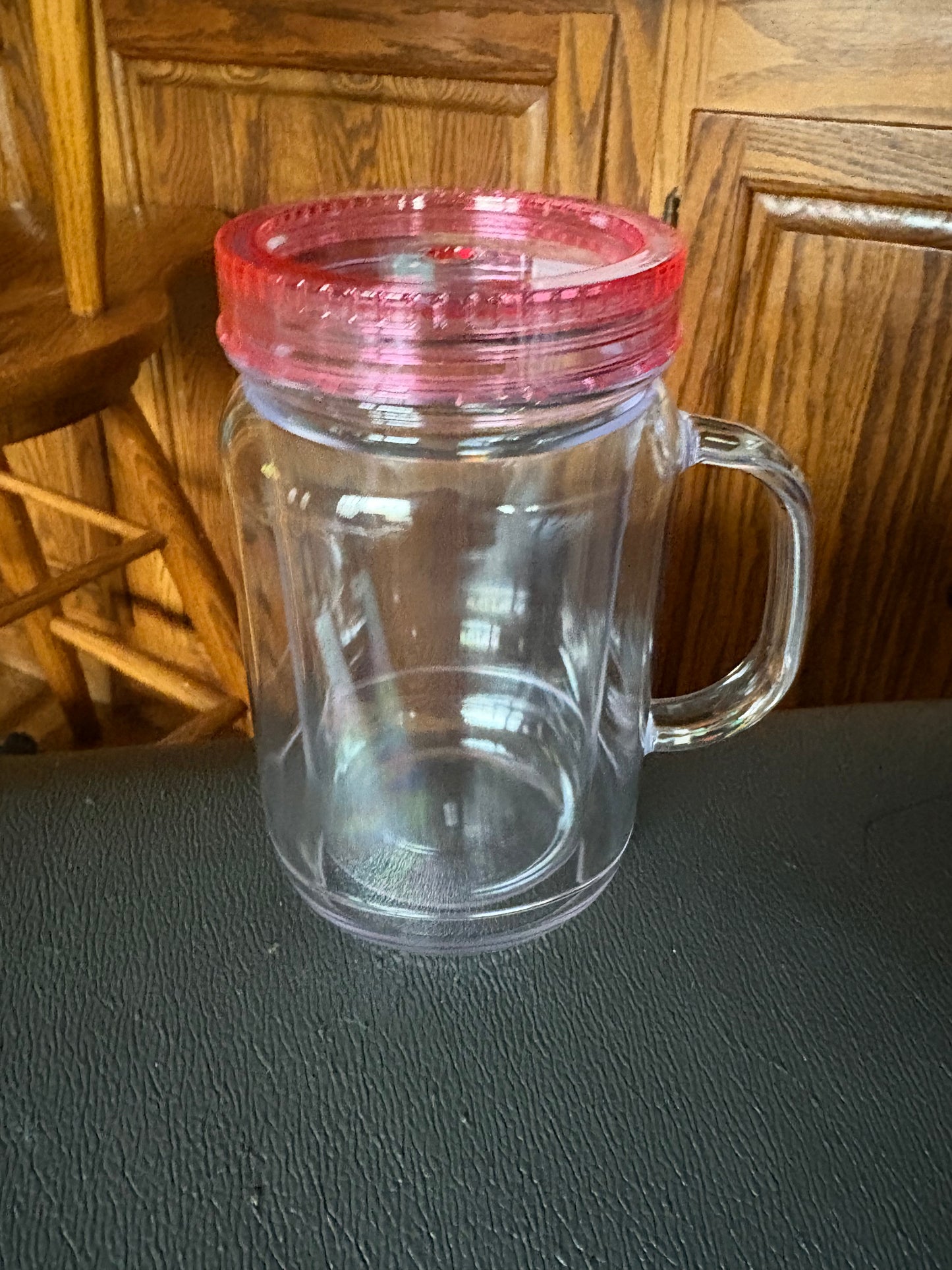 A 20 oz mason jar snow globe cup